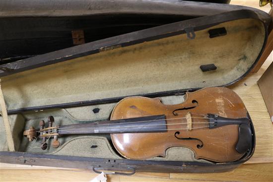 Three half size violins, a quantity of bows and six violin cases